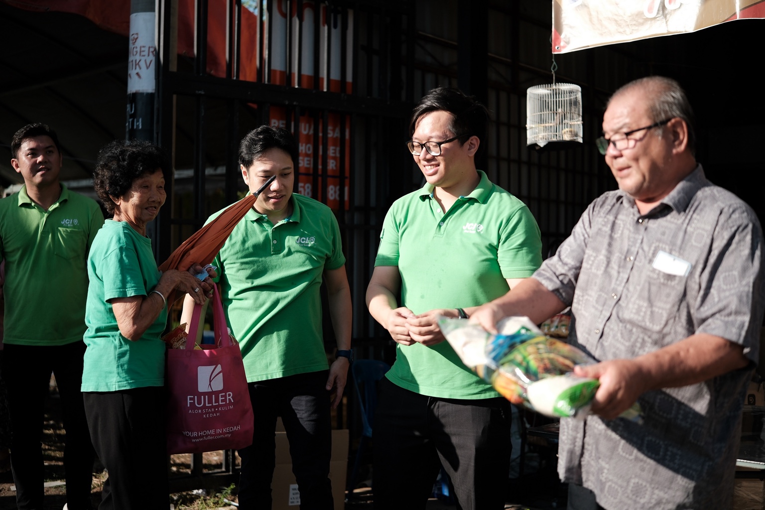JCI Alor Setar members taking part in an essential-supplies handover